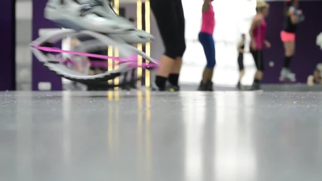 Close up of side view of fitness class wearing Kangoo Shoes.
