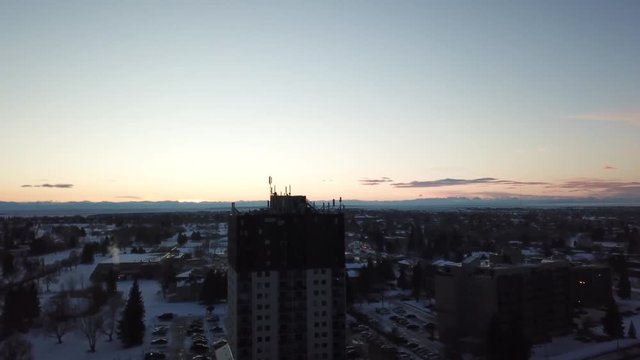 Footage of a drone being flown over an apartment building