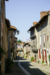 Streets and buildings of medieval french old town in summer on a sunny day