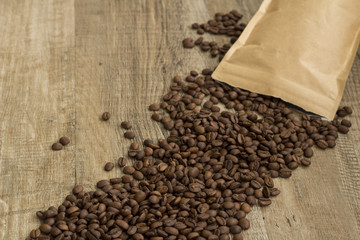 coffee beans spilling out of brown bag