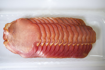 Slices of iberian cured loin on the package