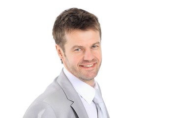 portrait of young businessman in a gray suit.