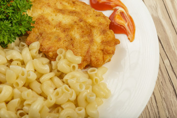 Pasta with a piece of grilled meat and salad.