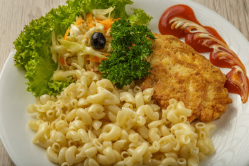 Pasta with a piece of grilled meat and salad.