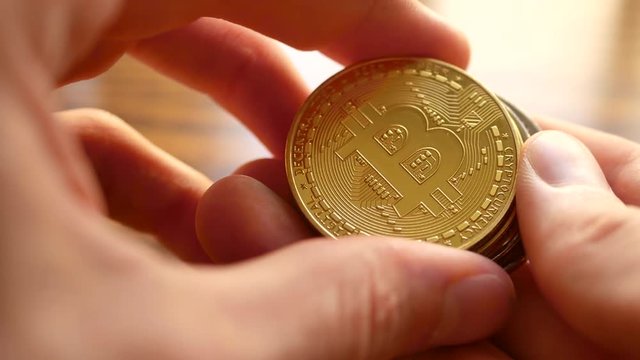 Close up of Bitcoin cryptocurrency shining in the sunlight.