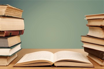 Collection of old books on wooden table