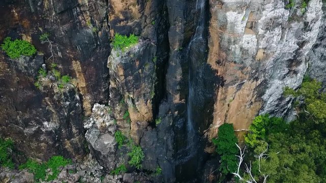 drone flying towards cliff face springbrook queensland gold coast rainforest