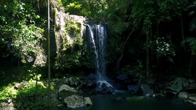 drone flying towards cliff face springbrook queensland gold coast rainforest