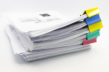 Stack of papers documents in archives files with paper clips on desk at offices, business concept.