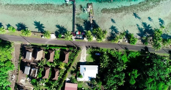 poonton and house at the edge of a lagoon in aerial view, french polynesia
