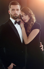 Elegant couple passing in classic clothes.