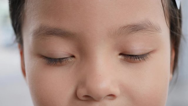 Close up portrait of the beautiful little girl eye open.