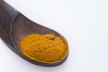 turmeric powder in bowl isolated on white background, curcuma longa