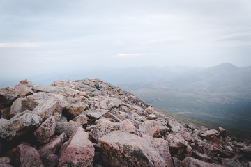 Fototapeta na wymiar A person hiking on top of Mount Bierstadt in Colorado. 