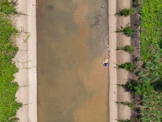 Asian fisherman catching fish
