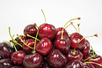 close up of red cherry pile with water droplets
