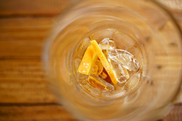 Iced cold brew coffee with slice of orange