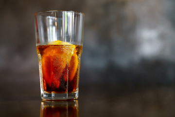 Iced cold brew coffee with slice of orange
