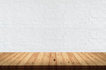 wood table with white brick wall background.
