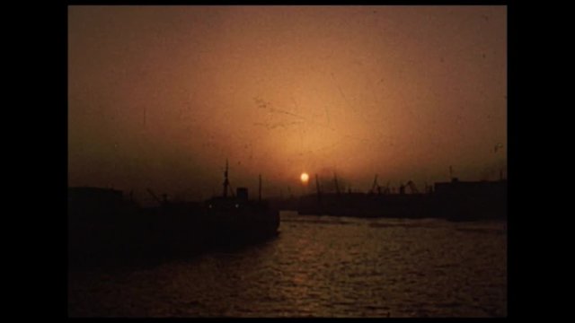 Sunset at the harbor on the island of Rhodes. Super 8mm vintage filmstock from 70's