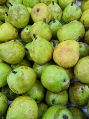 Pears huddled on supermarket shelf. Close Up Pears