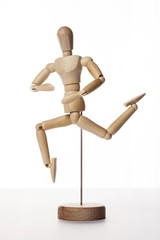 Wooden Dummy human jump isolated white.