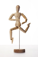 Wooden Dummy human jump isolated white.