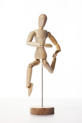 Wooden Dummy human jump isolated white.