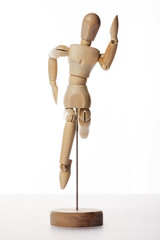 Wooden Dummy human jump isolated white.