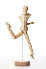Wooden Dummy human jump isolated white.