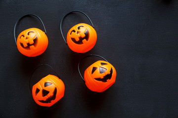 Halloween background with pattern of jack lanterns on black background.  creative decoration, celebration, autumn concept 