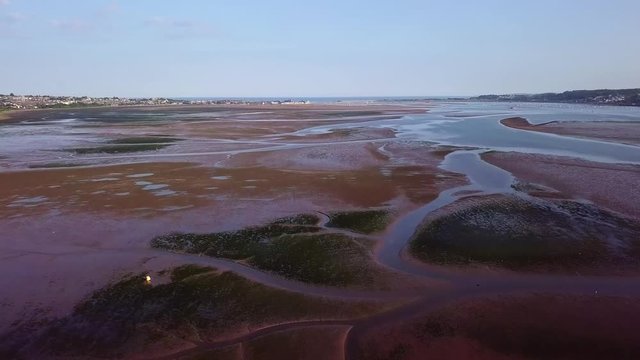 Red mud flats, dry river bed. Lympstone, England. Aerial view.