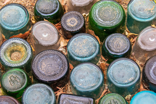 Whimsical Garden Art Decoration - Bottles Buried in Garden