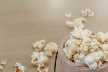 popcorn in wood bowl