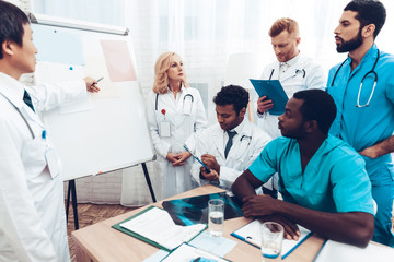 Fototapeta premium Teamwork Medical Consultation With Head Doctor.
