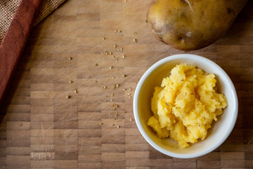 A homemade serving of mashed potatoes. A easy dish made with potatoes, unsalted butter and milk.