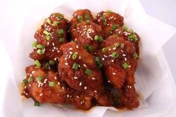Korean fried chicken with white backdrop.
