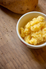 A homemade serving of mashed potatoes. A easy dish made with potatoes, unsalted butter and milk.