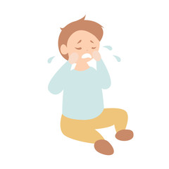 Cute toddler boy crying on the floor
