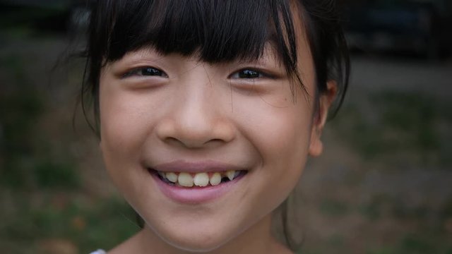 Portrait of Asian little girl smiling look at camera