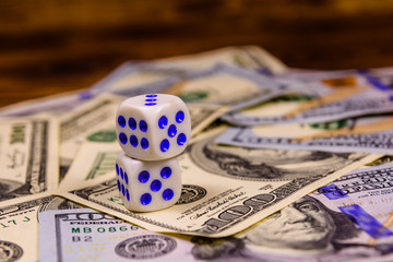 Dice on the one hundred dollar bills. Gamble concept