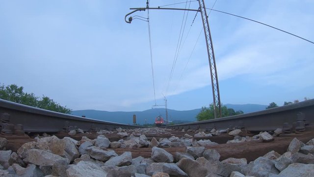 Low angle of a passenger train driving above the camera