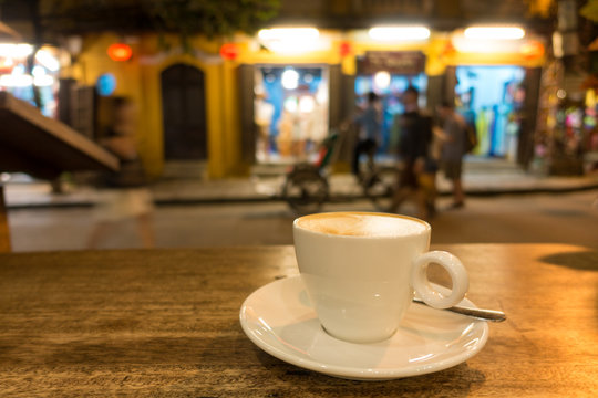 A cup of cappuccino coffee in night. Royalty high quality free stock image of a cup of cappuccino coffee in a coffee shop. Drink coffee is the habit of many people 