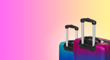 Colorful horizontal banner with two suitcases and copyspace. Travelling concept.
