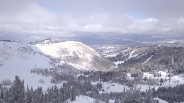 Aerial shot of mountains in the winter with snow.
