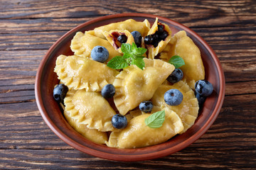 blueberry dumplings, pierogi, vareniki in a bowl