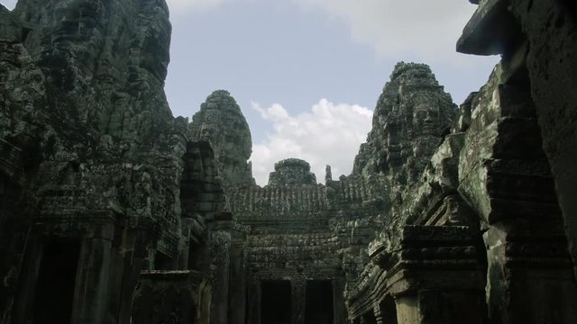 Timelapse tilt down day to night of Bayon courtyard Angkor Wat Cambodia Siem Reap