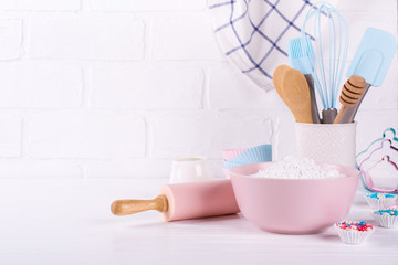 Bakery utensils. Kitchen tools for baking on a white wooden background.
