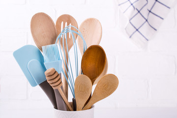 Set of kitchen utensils, wooden and silicone, free copy space . Close up