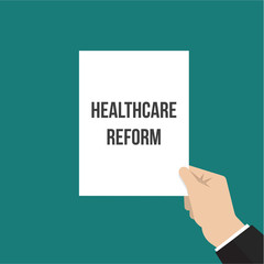 Man showing paper HEALTHCARE REFORM text